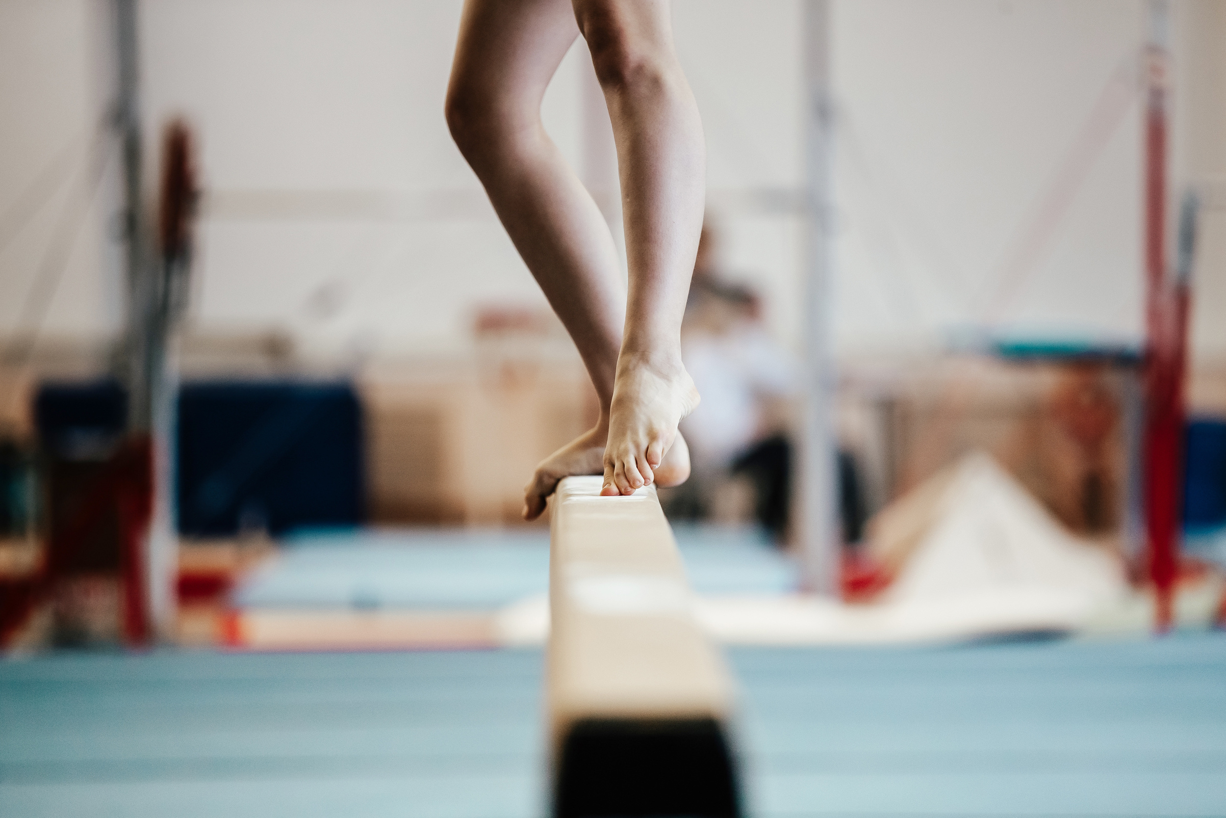 competition gymnastics exercises on balance beam girl gymnast