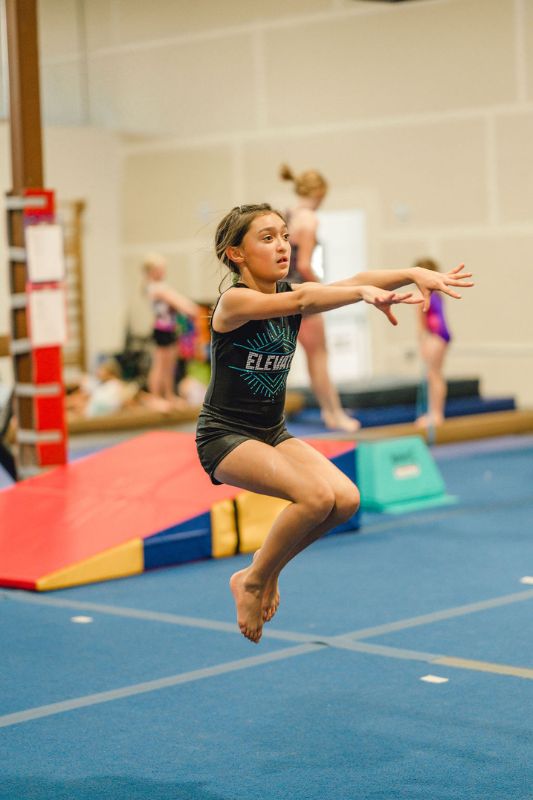 gymnastics terms gymnast jumping on the ground