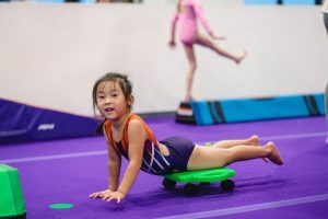 Movement-Based Learning kid on cart