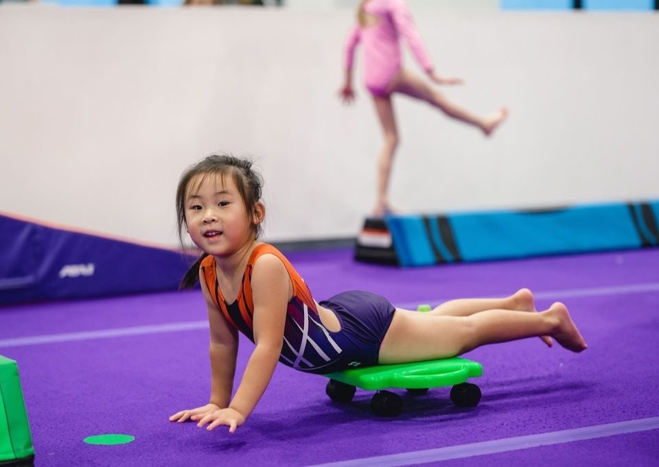 Movement-Based Learning kid on cart