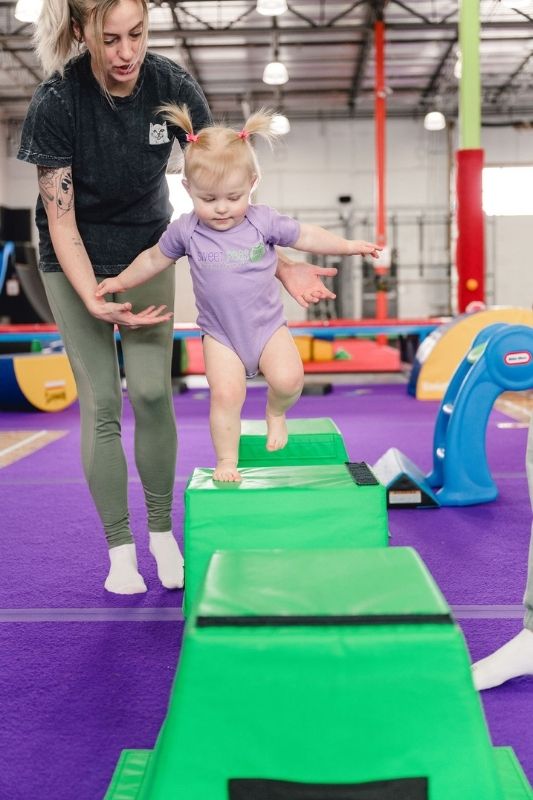 Movement-Based Learning kid balancing on blocks