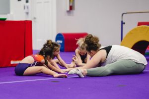 Consistency kids stretching in class session