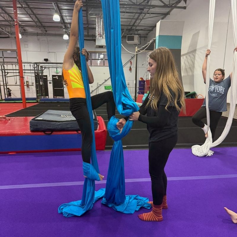Build confidence silks class with coach instructing student