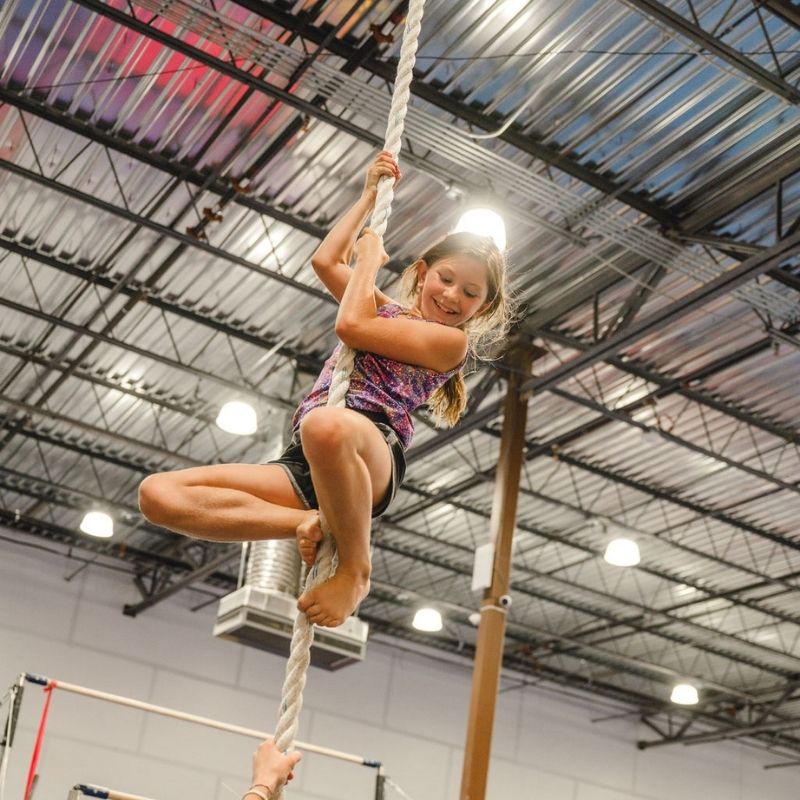 Help in School confident child climbing the rope