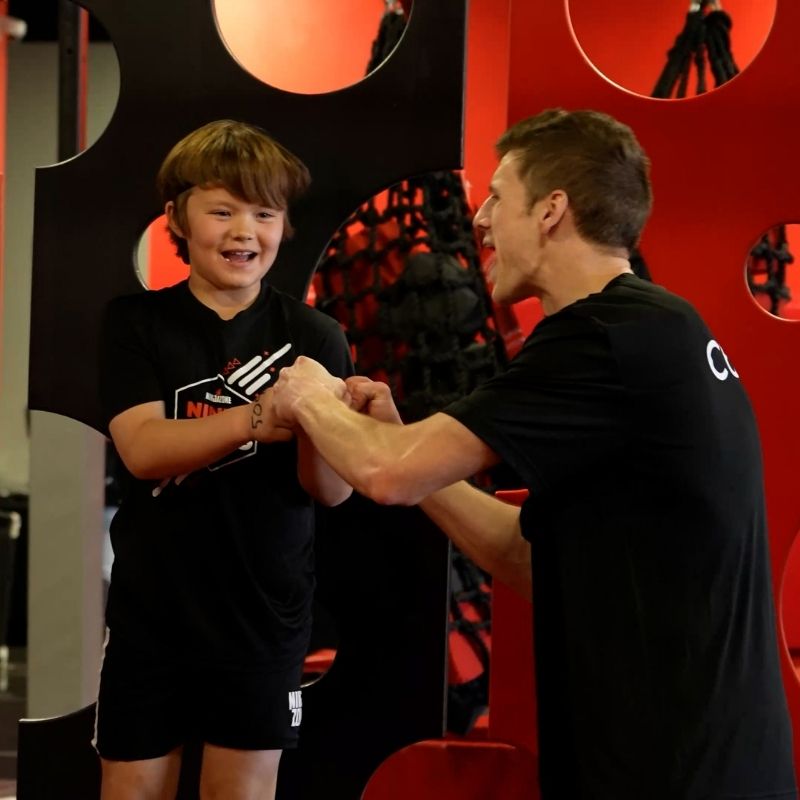Social Skills ninjazone coach fistbumping kid in class
