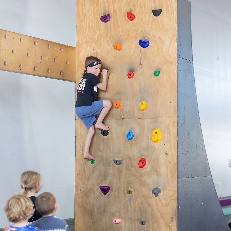 gymnastics age lil ninja climing the rock wall